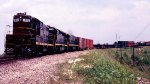 Seaboard Coast Line GP7 #1002, SD45 #2010 and U30C 2124, with heavy exhaust as the engineer throttles up for the climb out of the sand flats, lead train #336 